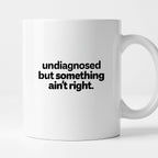 Kubek z nadrukiem - "undiagnosed but something ain't right"