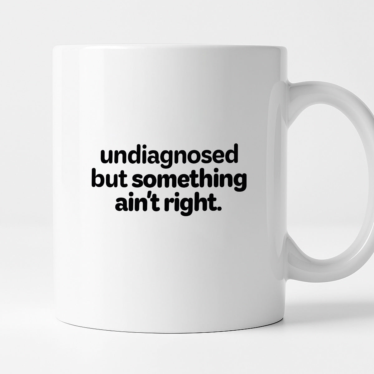 Kubek z nadrukiem - "undiagnosed but something ain't right"