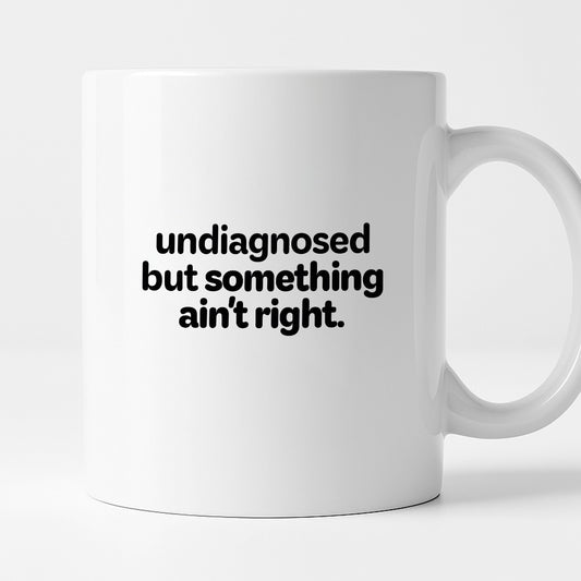 Kubek z nadrukiem - "undiagnosed but something ain't right"