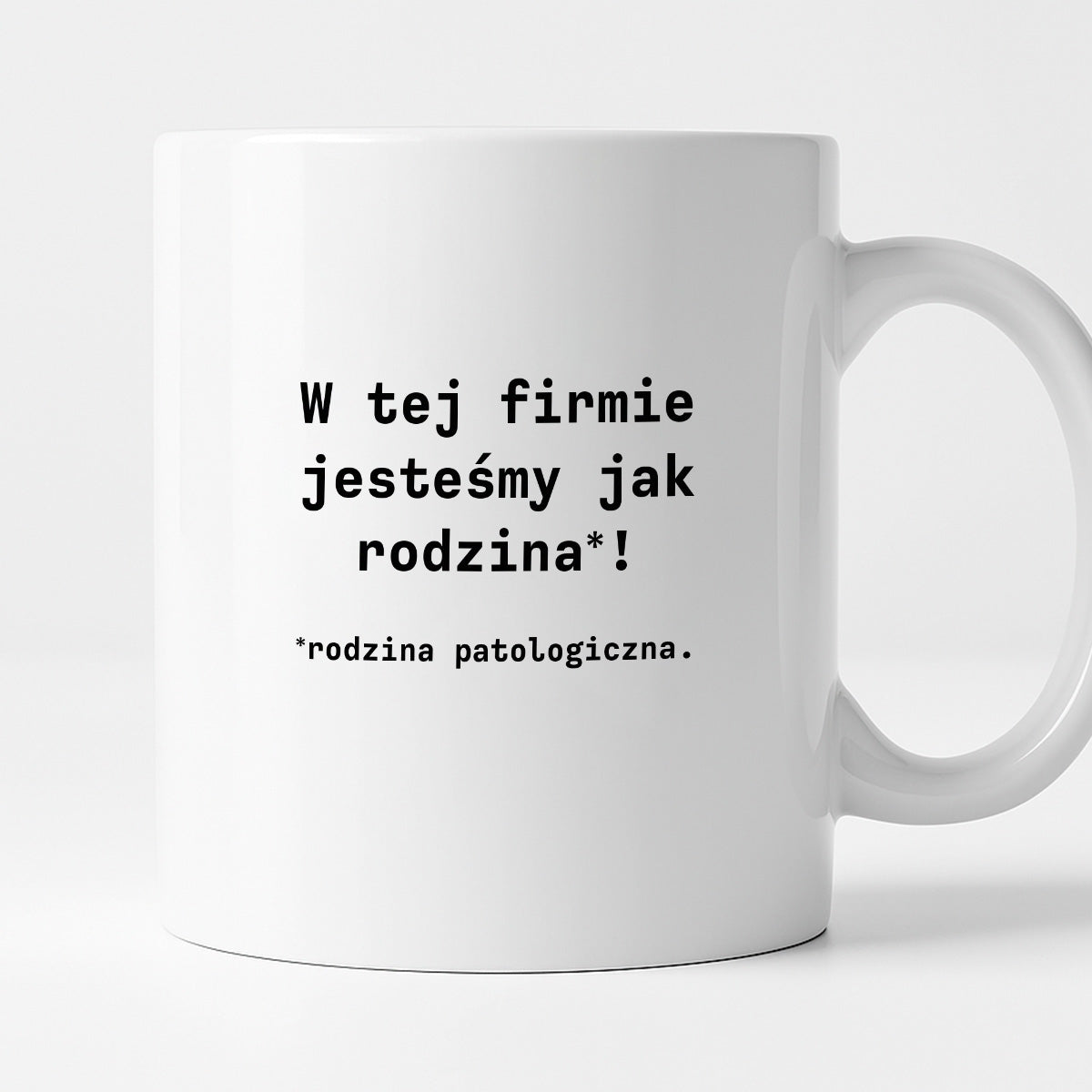 Kubek z nadrukiem "W tej firmie jestesmy jak rodzina*! Rodzina patologiczna."