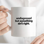 Kubek z nadrukiem - "undiagnosed but something ain't right"