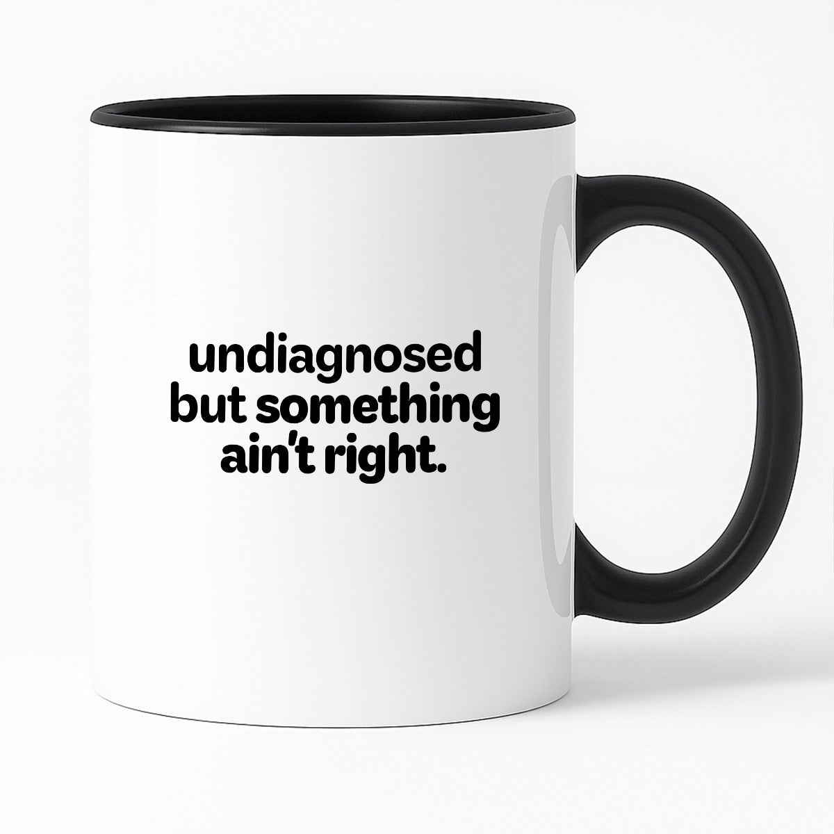 Kubek z nadrukiem - "undiagnosed but something ain't right"