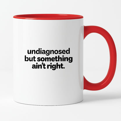 Kubek z nadrukiem - "undiagnosed but something ain't right"