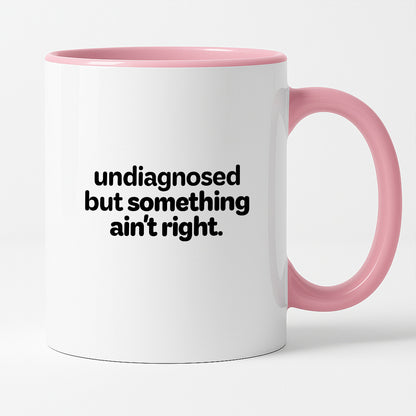 Kubek z nadrukiem - "undiagnosed but something ain't right"