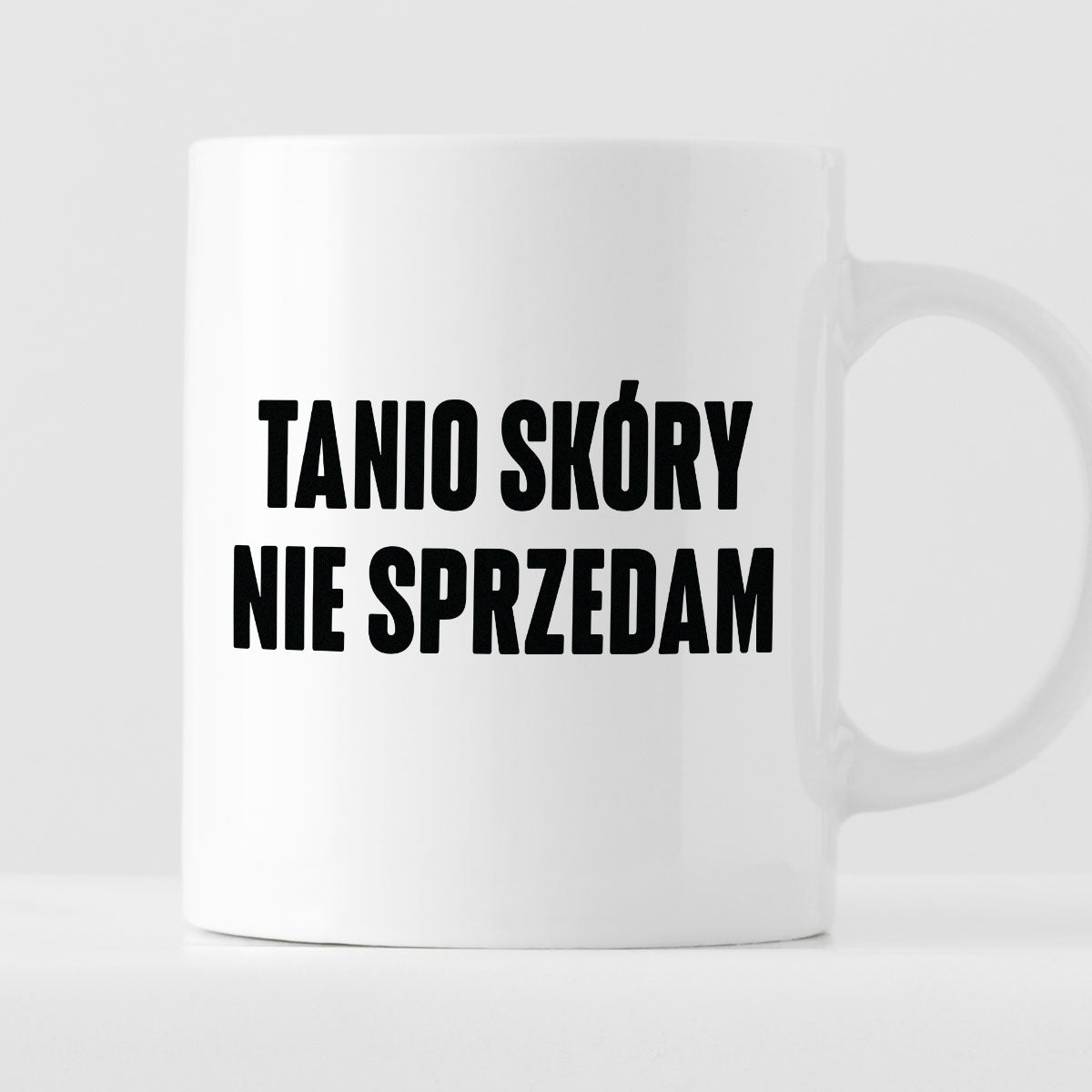 Kubek z nadrukiem "Tanio skóry nie sprzedam" cytat M. Pudzianowski