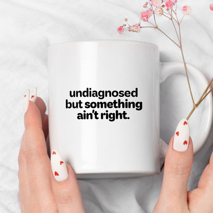 Kubek z nadrukiem - "undiagnosed but something ain't right"
