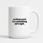 Kubek z nadrukiem - "undiagnosed but something ain't right"