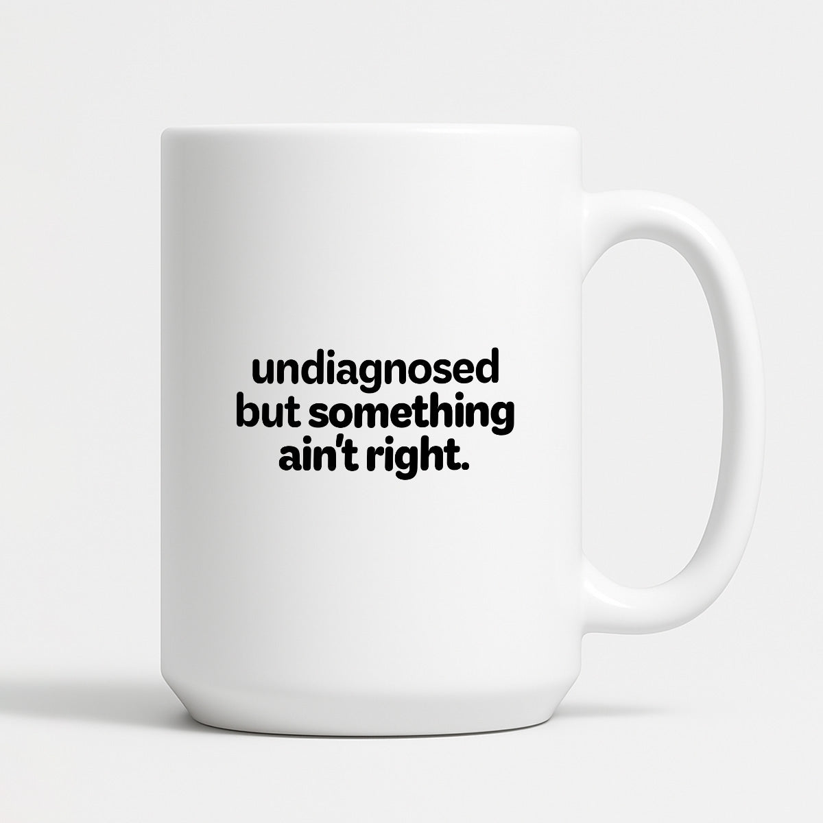 Kubek z nadrukiem - "undiagnosed but something ain't right"