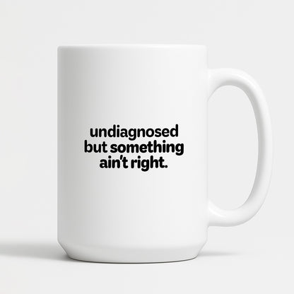 Kubek z nadrukiem - "undiagnosed but something ain't right"