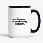 Kubek z nadrukiem - "undiagnosed but something ain't right"