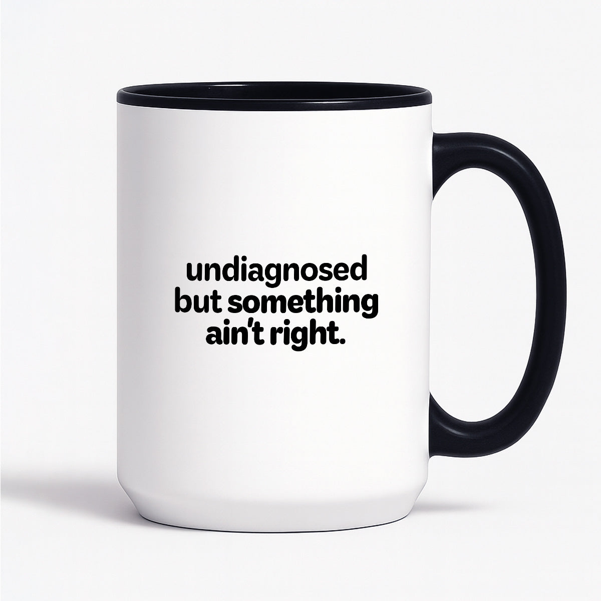 Kubek z nadrukiem - "undiagnosed but something ain't right"