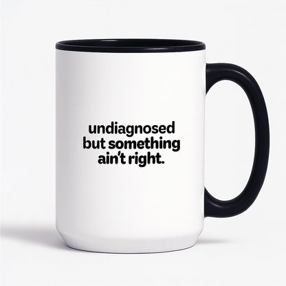 Kubek z nadrukiem - "undiagnosed but something ain't right"