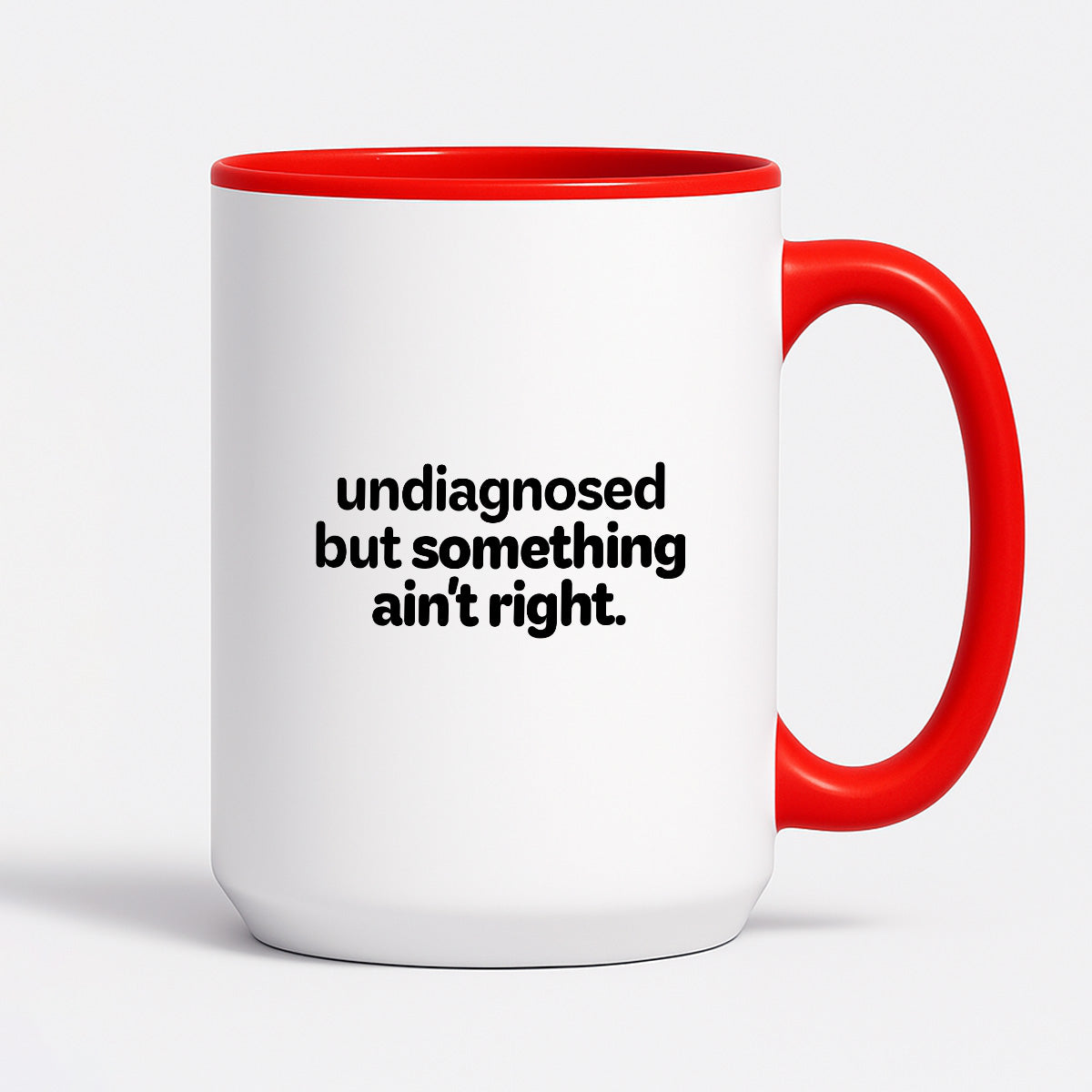 Kubek z nadrukiem - "undiagnosed but something ain't right"