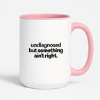 Kubek z nadrukiem - "undiagnosed but something ain't right"