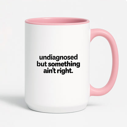 Kubek z nadrukiem - "undiagnosed but something ain't right"
