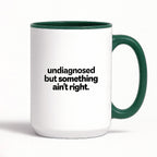 Kubek z nadrukiem - "undiagnosed but something ain't right"
