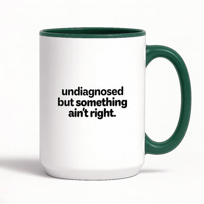 Kubek z nadrukiem - "undiagnosed but something ain't right"