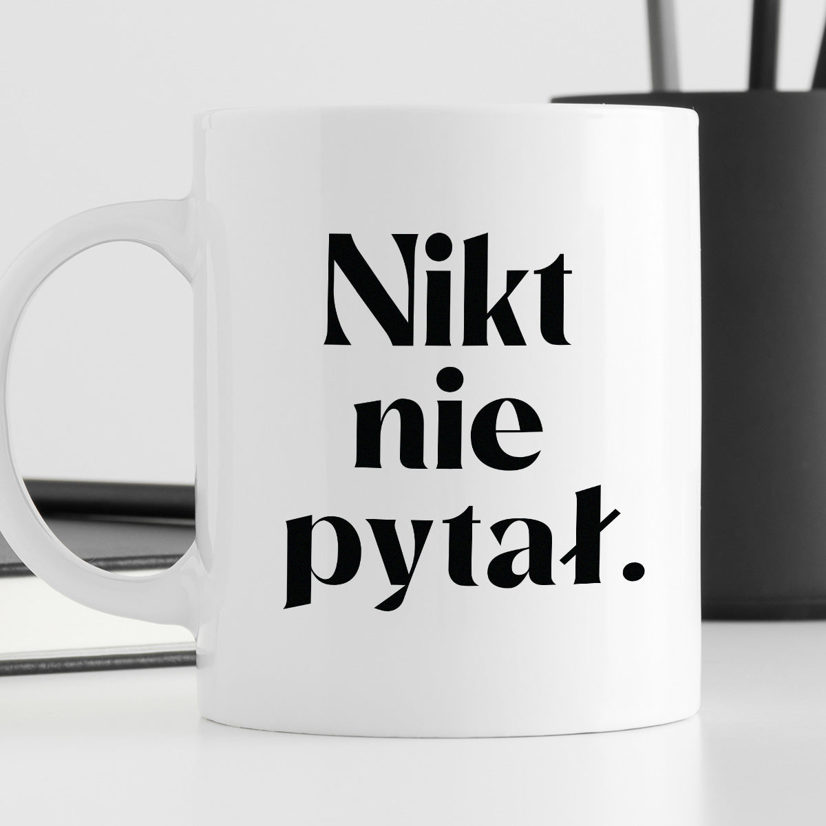 Kubek z nadrukiem "Nikt nie pytał."