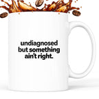 Kubek z nadrukiem - "undiagnosed but something ain't right"