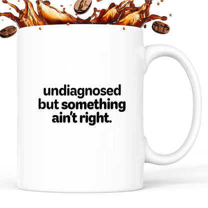Kubek z nadrukiem - "undiagnosed but something ain't right"
